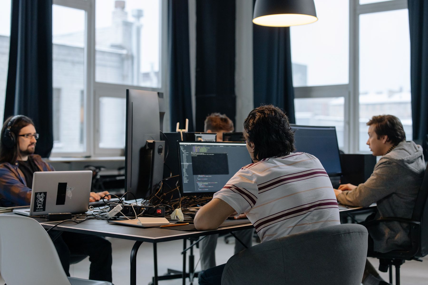 Software specialists working together in a startup office